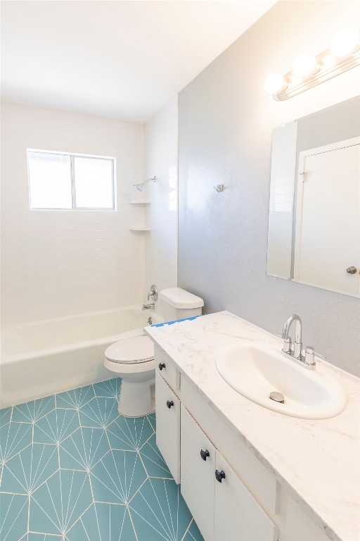 full bathroom featuring vanity, tiled shower / bath combo, toilet, and tile patterned floors