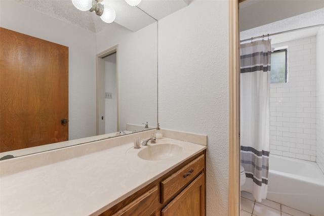 bathroom with vanity, a textured ceiling, shower / tub combo with curtain, and tile patterned floors