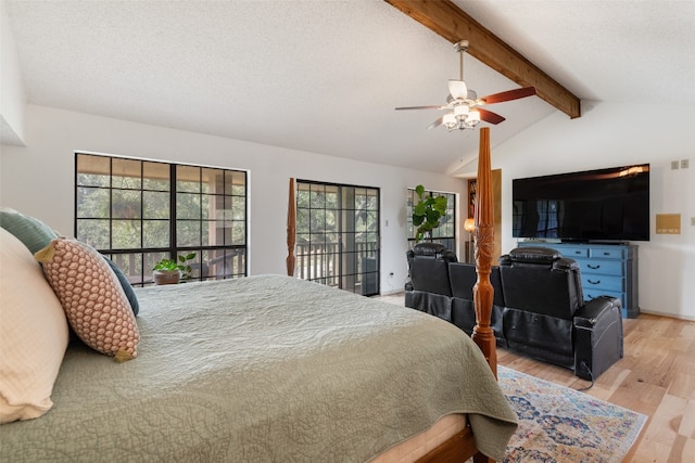 bedroom with light hardwood / wood-style floors, lofted ceiling with beams, multiple windows, and ceiling fan