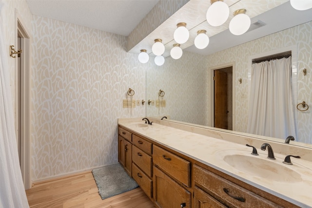 bathroom with vanity and hardwood / wood-style flooring