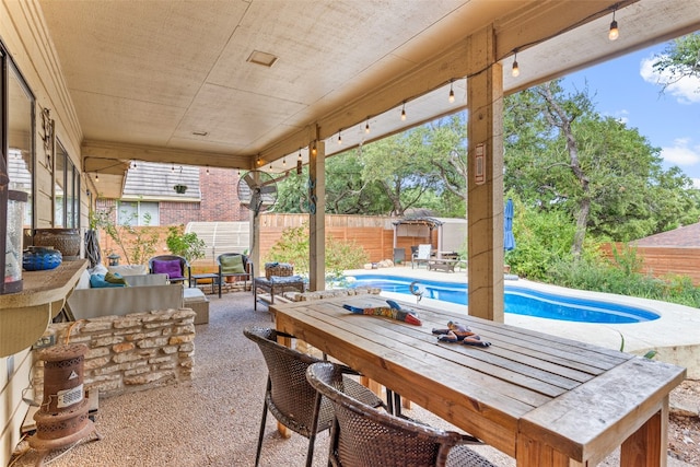 view of patio / terrace featuring a fenced in pool