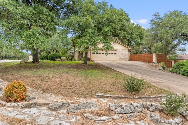 view of front of home featuring a front lawn and a garage