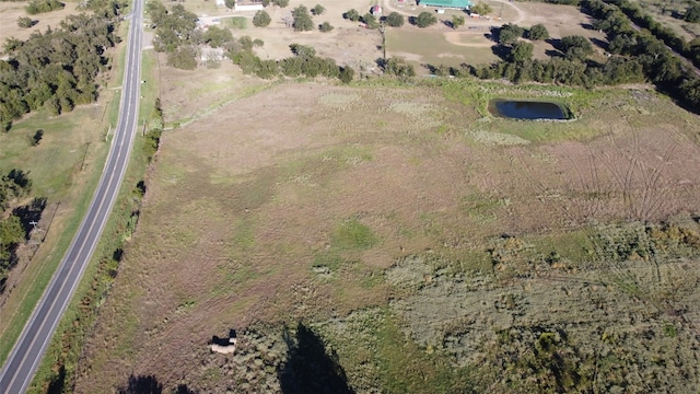 birds eye view of property featuring a rural view