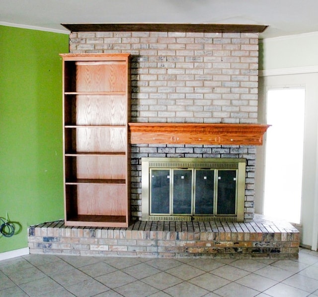 room details with crown molding, a fireplace, and tile patterned flooring