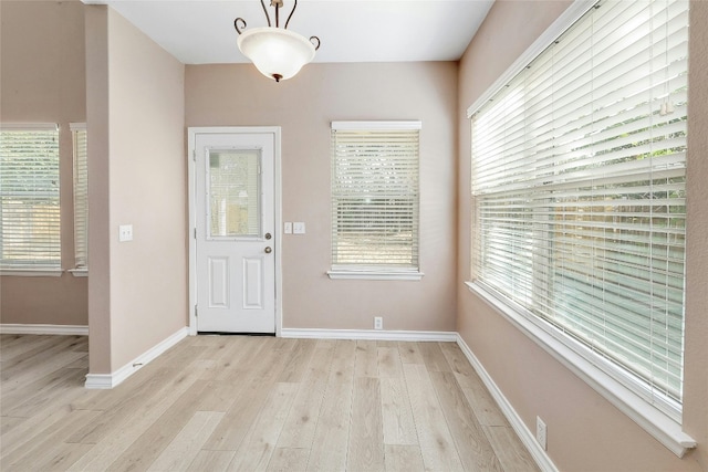 entryway with light hardwood / wood-style floors