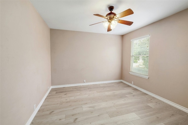 empty room featuring ceiling fan and light hardwood / wood-style floors