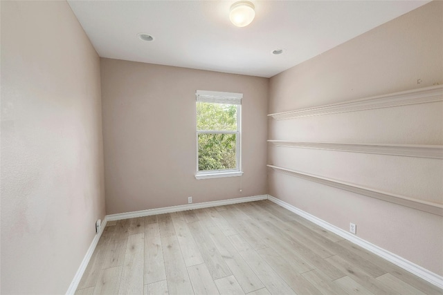 spare room featuring light hardwood / wood-style floors