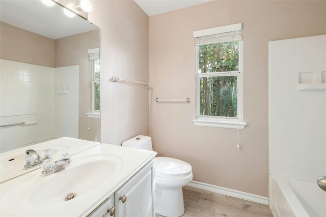 full bathroom featuring shower / bathing tub combination, vanity, toilet, and hardwood / wood-style flooring