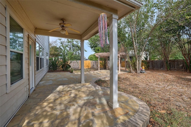 view of patio featuring ceiling fan