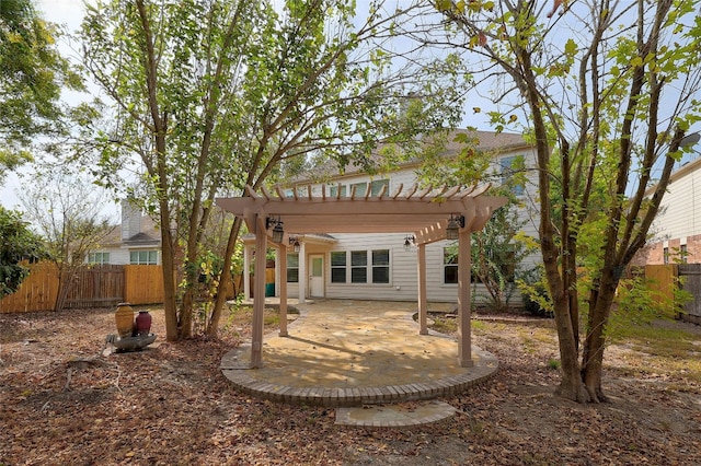 back of house featuring a pergola and a patio area