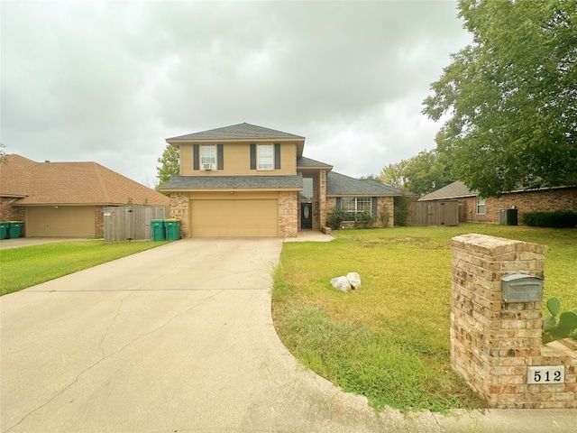 split level home featuring a front yard and a garage