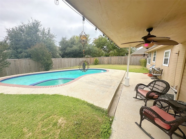 view of pool with a lawn, ceiling fan, and a patio area