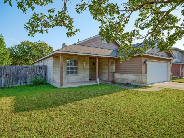 view of front facade with a garage and a front yard