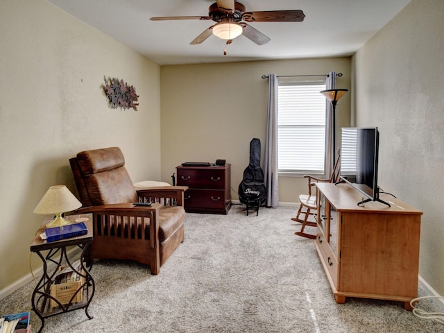 carpeted home office with ceiling fan