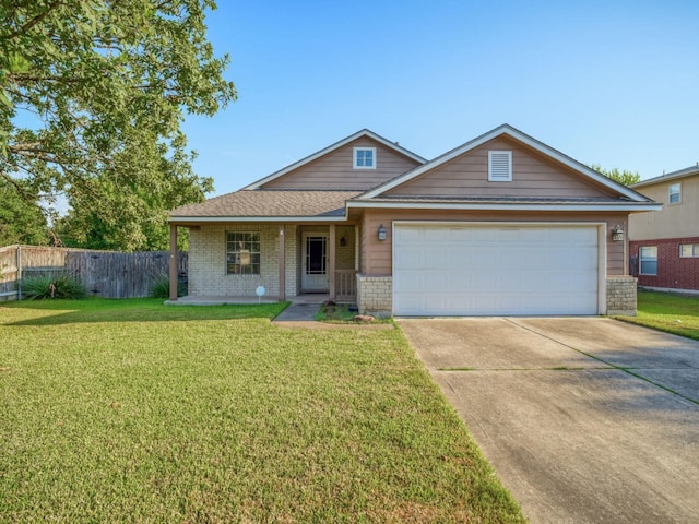 view of front of home featuring a garage and a front lawn