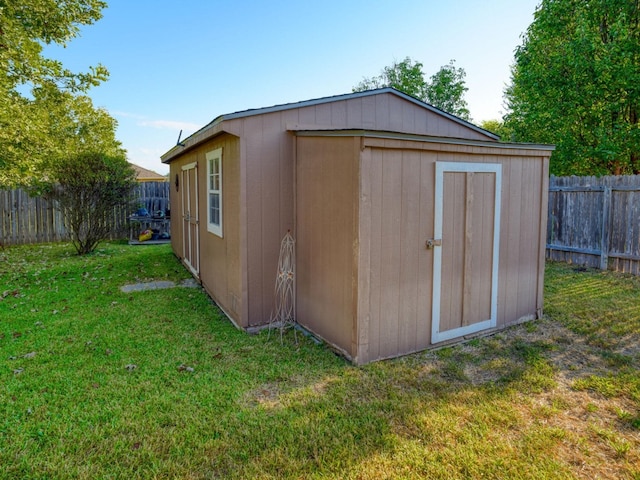 view of outdoor structure with a lawn