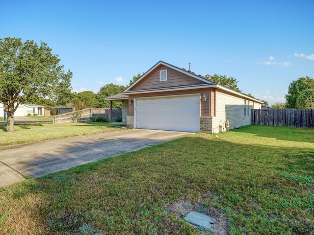 view of front of home with a garage and a front lawn