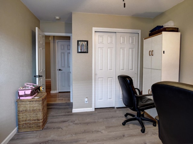 home office with hardwood / wood-style floors