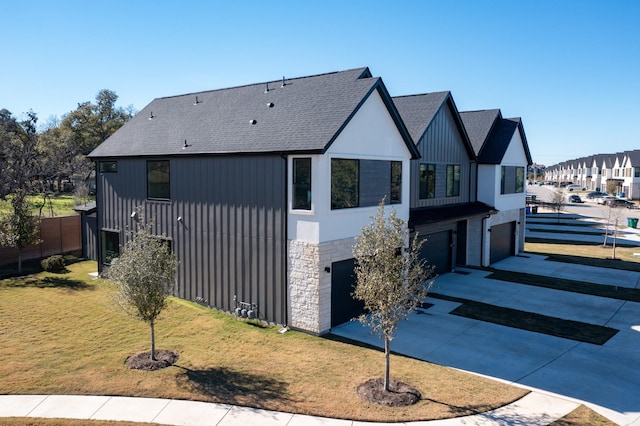 view of property exterior featuring a garage and a yard