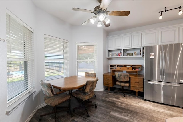 13639 Abrahamson Rd, Manor, TX 78653 - dining space featuring healthy amount of natural light, wood finished floors, baseboards, and a ceiling fan