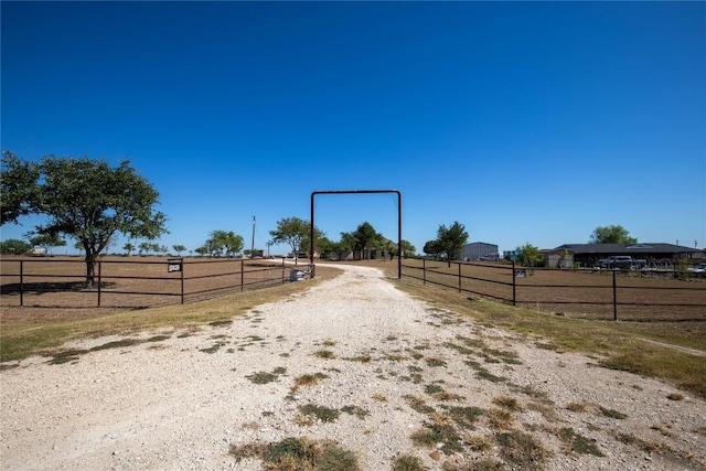 13639 Abrahamson Rd, Manor, TX 78653 - view of dirt / gravel road with a gated entry and a rural view