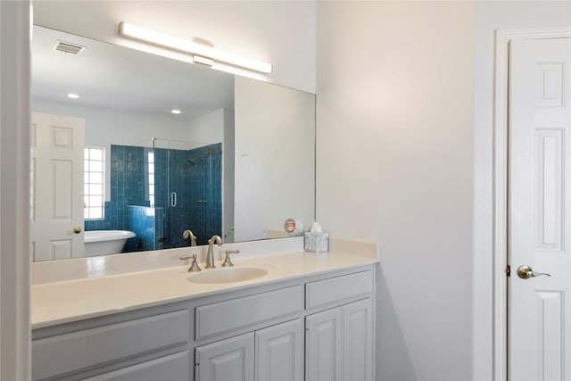 13639 Abrahamson Rd, Manor, TX 78653 - bathroom featuring vanity, a stall shower, and recessed lighting