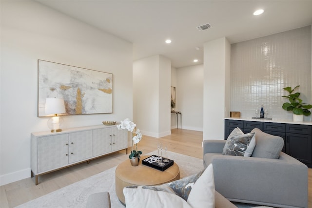 living room with light hardwood / wood-style flooring