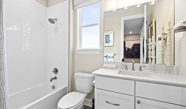 full bathroom featuring shower / tub combo with curtain, vanity, and toilet