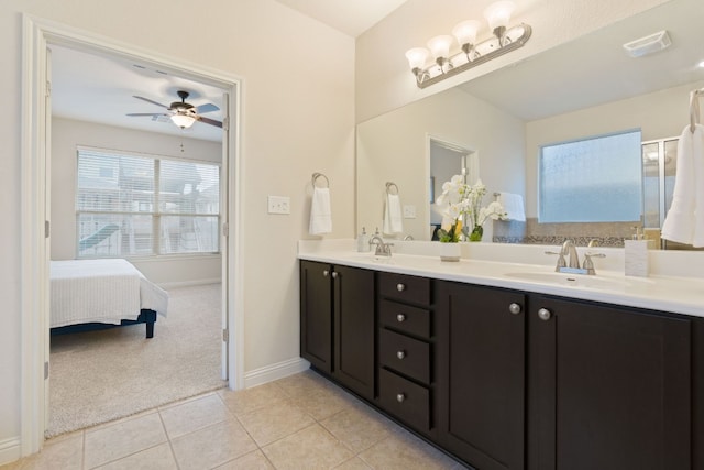 bathroom featuring tile patterned flooring, a shower with door, vanity, and ceiling fan