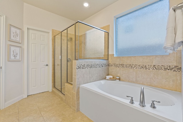 bathroom featuring tile patterned flooring and plus walk in shower