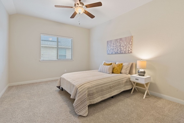 bedroom featuring lofted ceiling, ceiling fan, and carpet