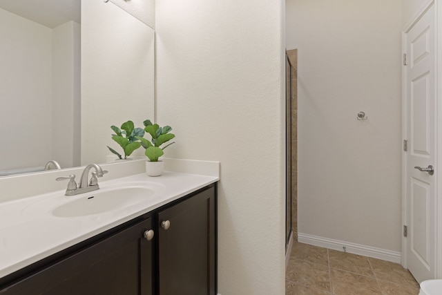 bathroom featuring vanity and tile patterned flooring