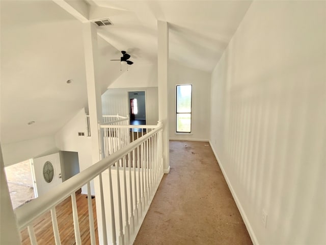 hallway featuring lofted ceiling and hardwood / wood-style floors