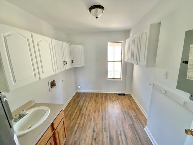 bathroom with vanity and wood-type flooring