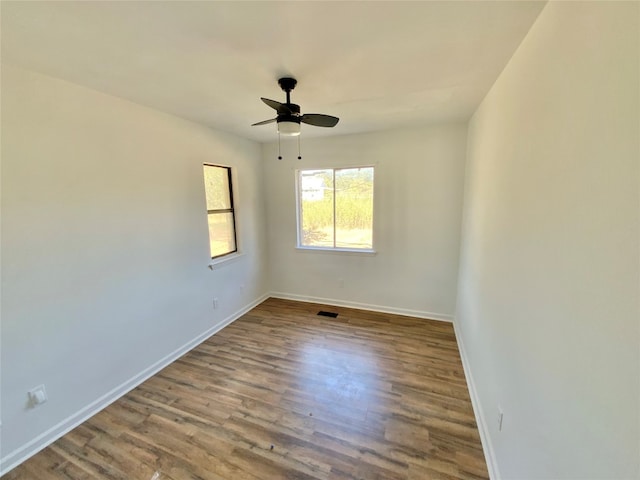 empty room featuring ceiling fan and light hardwood / wood-style floors