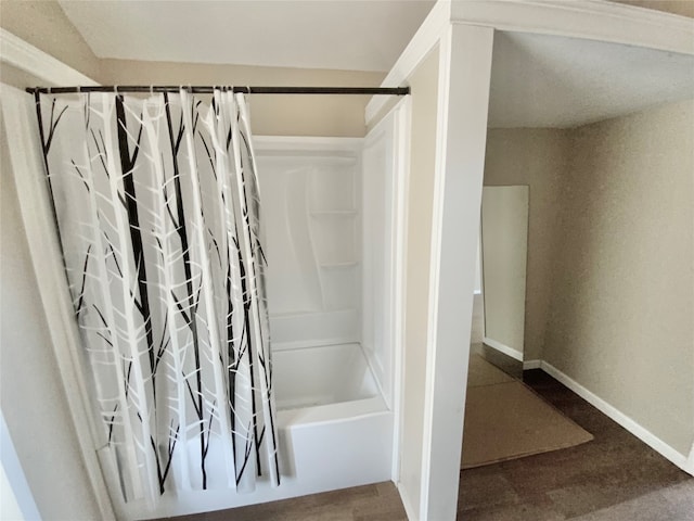 bathroom with shower / tub combo with curtain