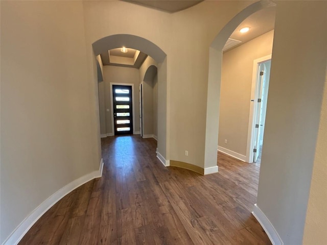 hall with dark hardwood / wood-style floors