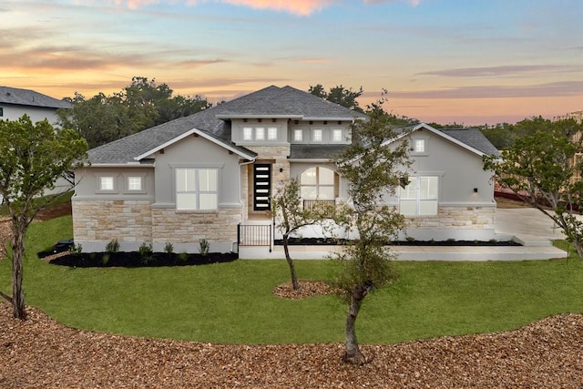 view of front of property with a lawn