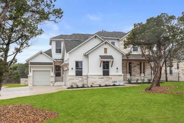 view of front of property featuring a garage and a front lawn