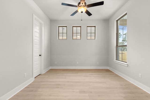 empty room featuring ceiling fan and light wood-type flooring