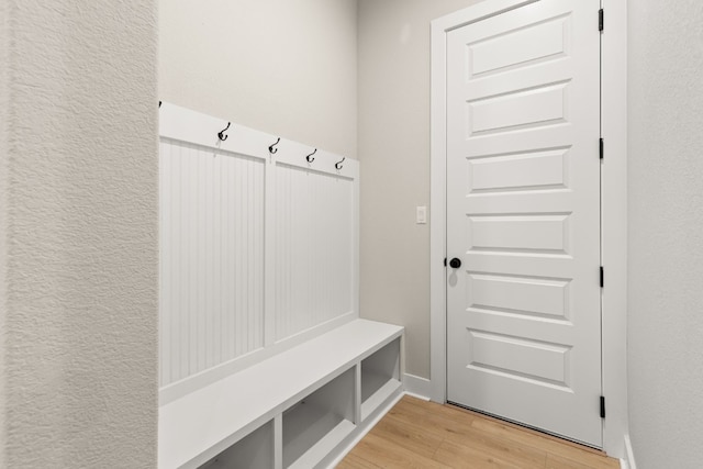 mudroom with light hardwood / wood-style flooring