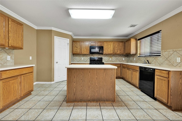 kitchen featuring decorative backsplash, black appliances, and a kitchen island