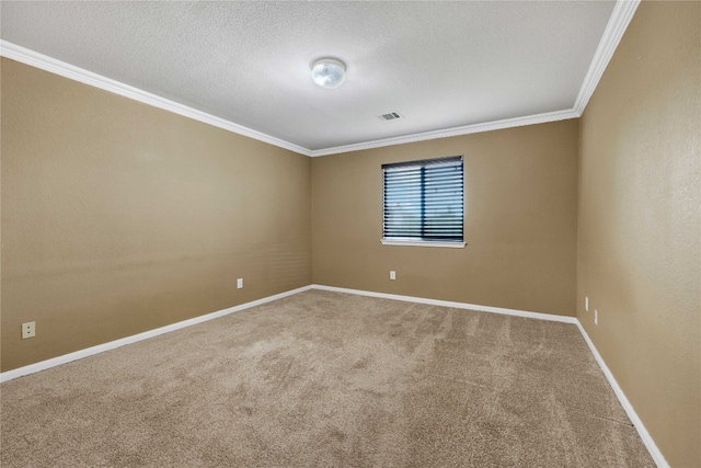 spare room featuring a textured ceiling, carpet flooring, and ornamental molding