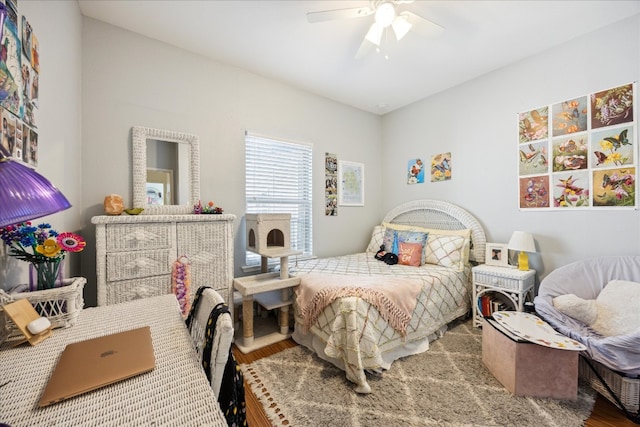 bedroom featuring ceiling fan and hardwood / wood-style flooring