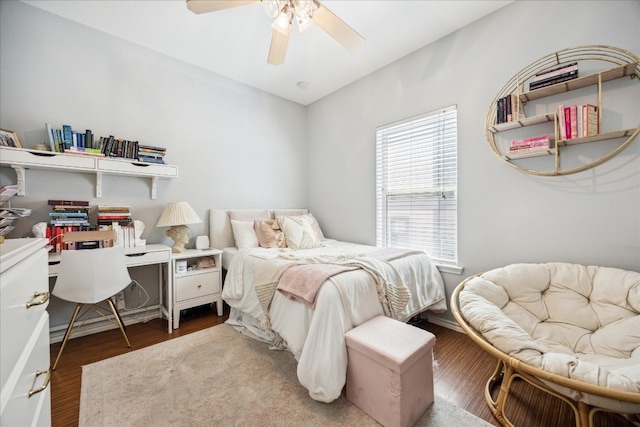 bedroom featuring wood-type flooring and ceiling fan