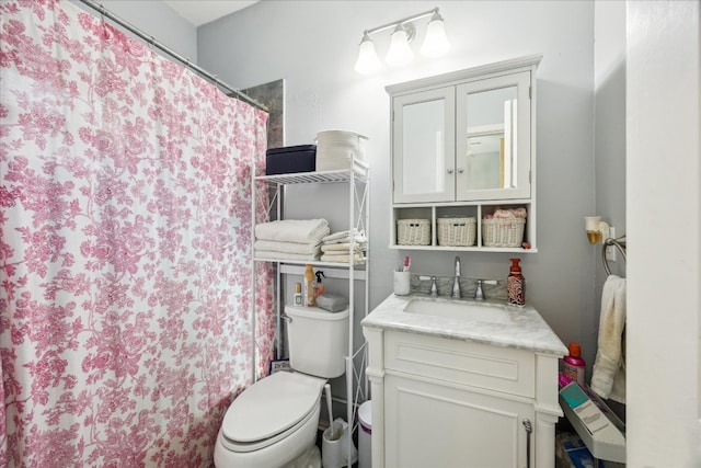 bathroom with vanity, toilet, and a shower with shower curtain