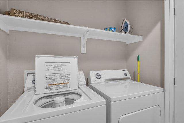 washroom with washer and clothes dryer