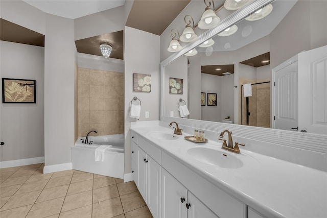 bathroom featuring shower with separate bathtub, vanity, and tile patterned floors