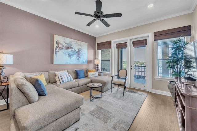 living room with ceiling fan, light hardwood / wood-style flooring, and crown molding