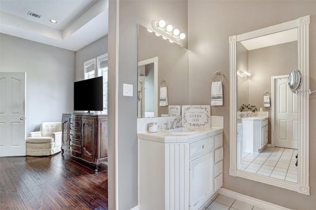 bathroom featuring vanity and hardwood / wood-style floors